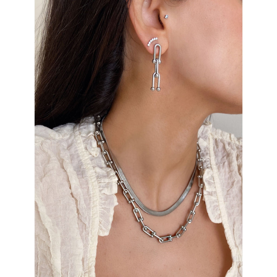 hardware chain necklace and earrings layered with flat snake chain in silver