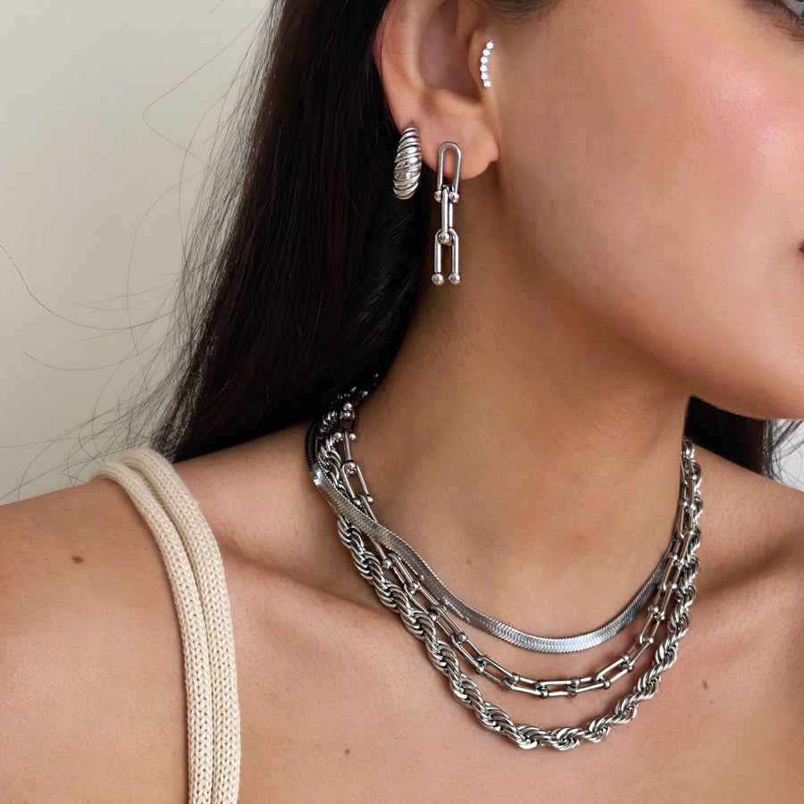 woman wearing chunky jewellery silver