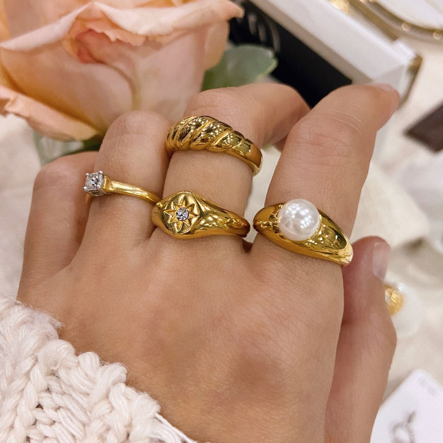 gold ring stack worn on hand