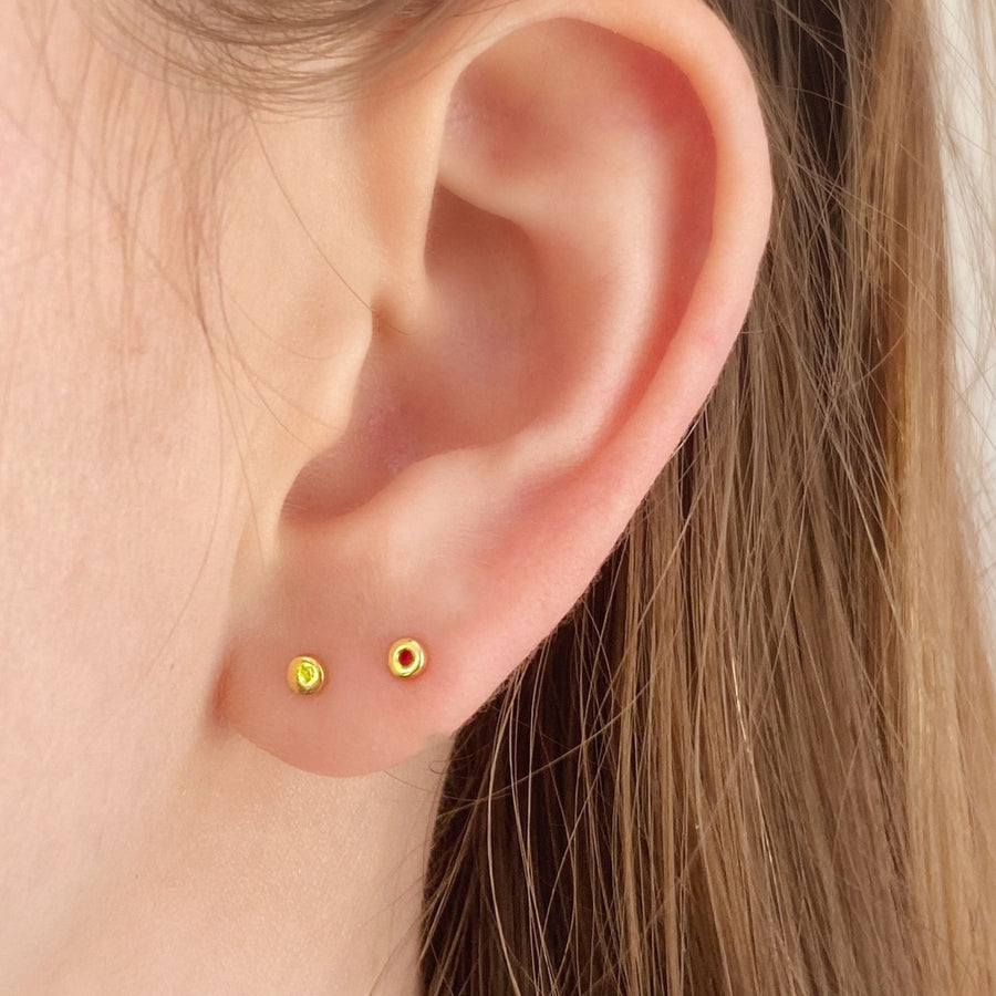small circle mismatched studs in gold