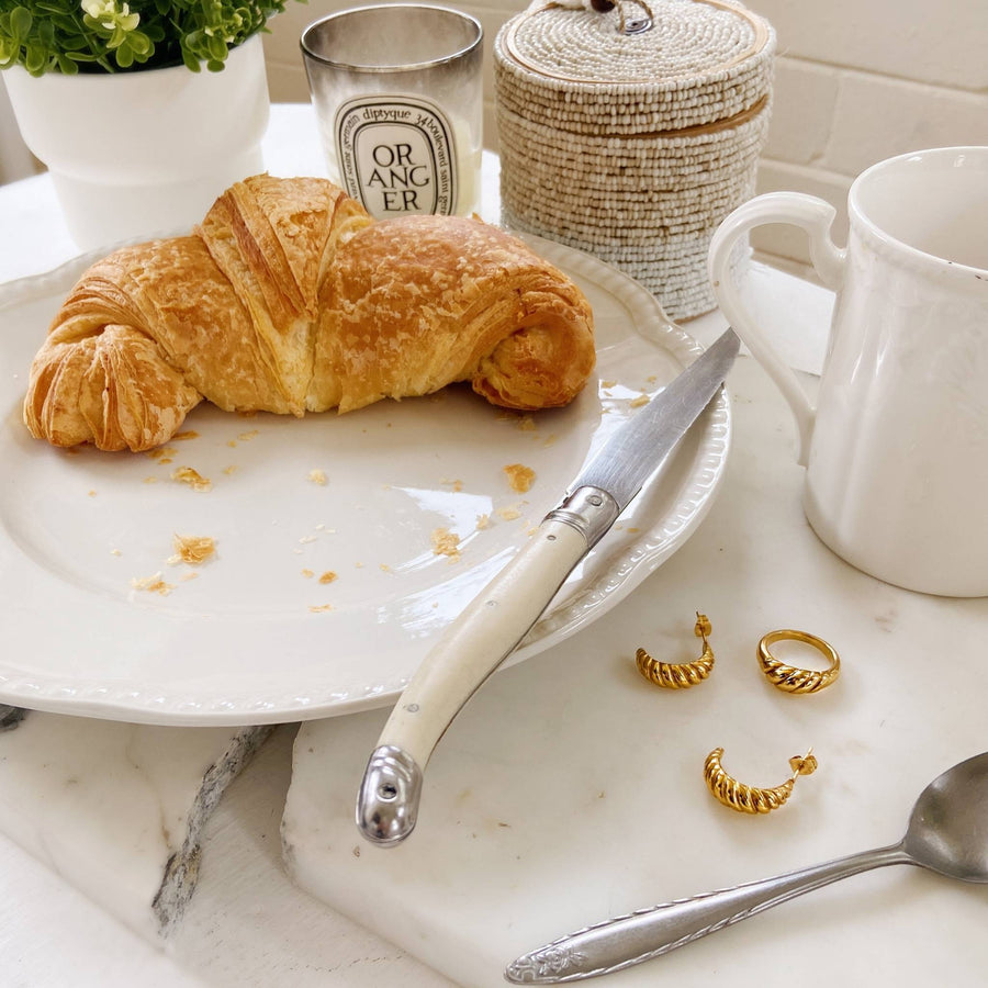croissant breakfast with gold ring and hoops