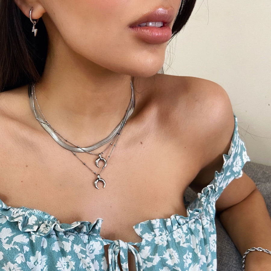 dainty horn necklaces in silver