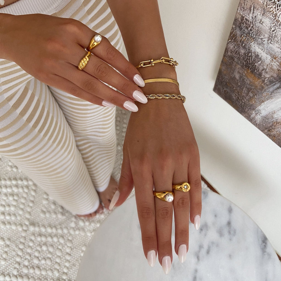 stacking gold rings with gold bracelets