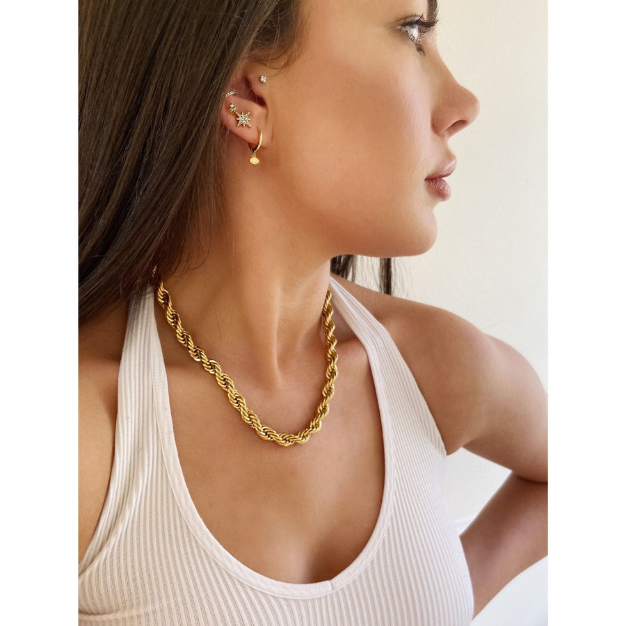 gold rope chunky chain worn with white tank top