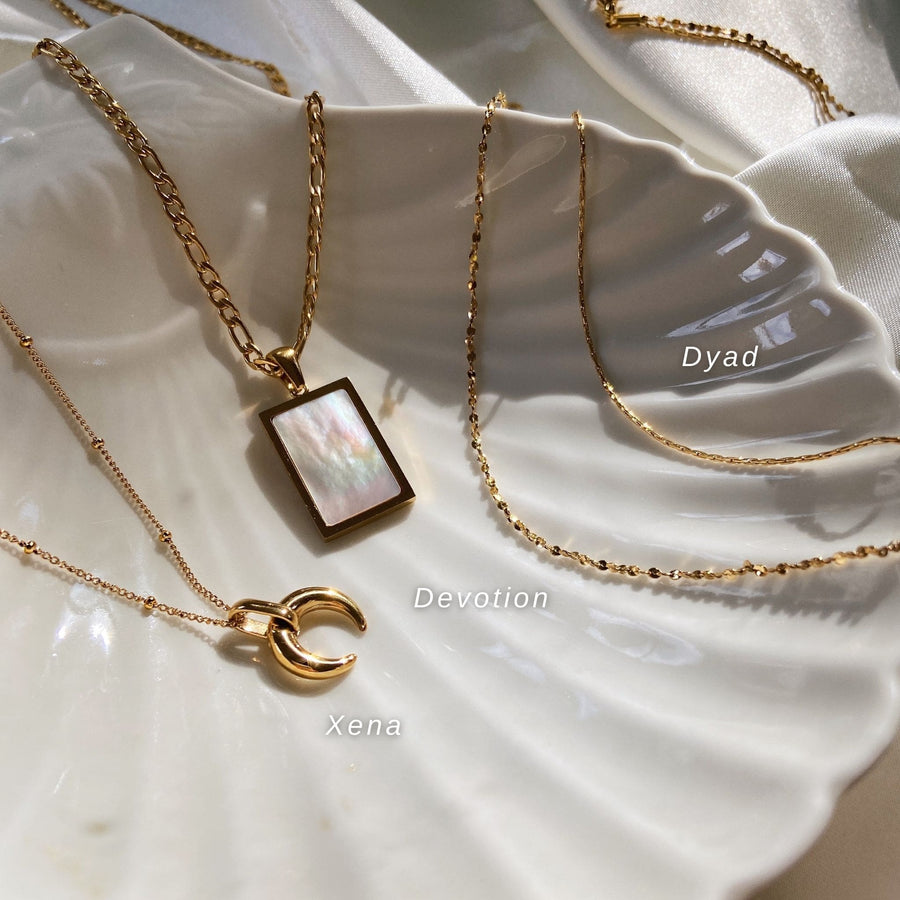 gold layered necklaces with horn and mother of pearl